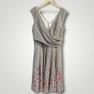 Elegant Black and White Patterned Dress with Red Accents